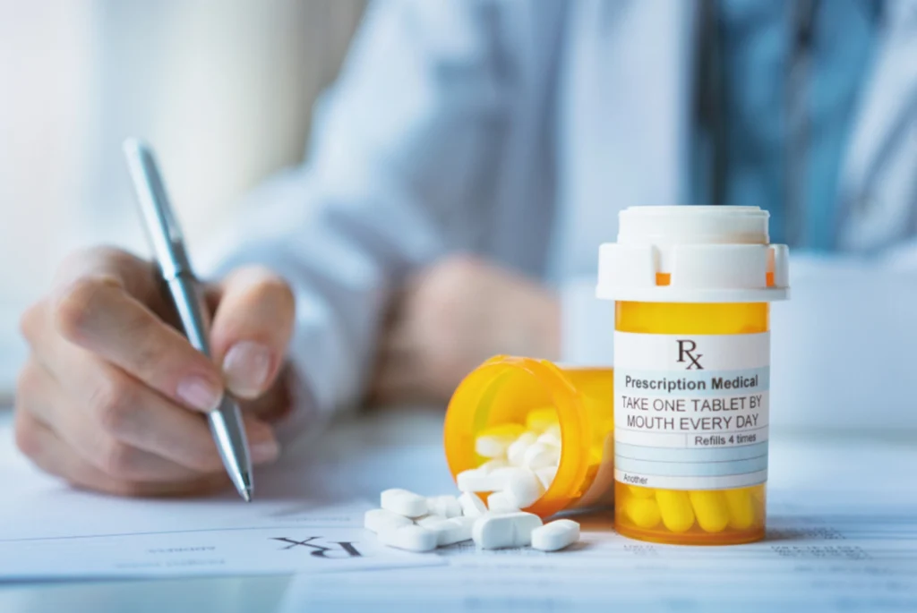 doctor with bottle of pills